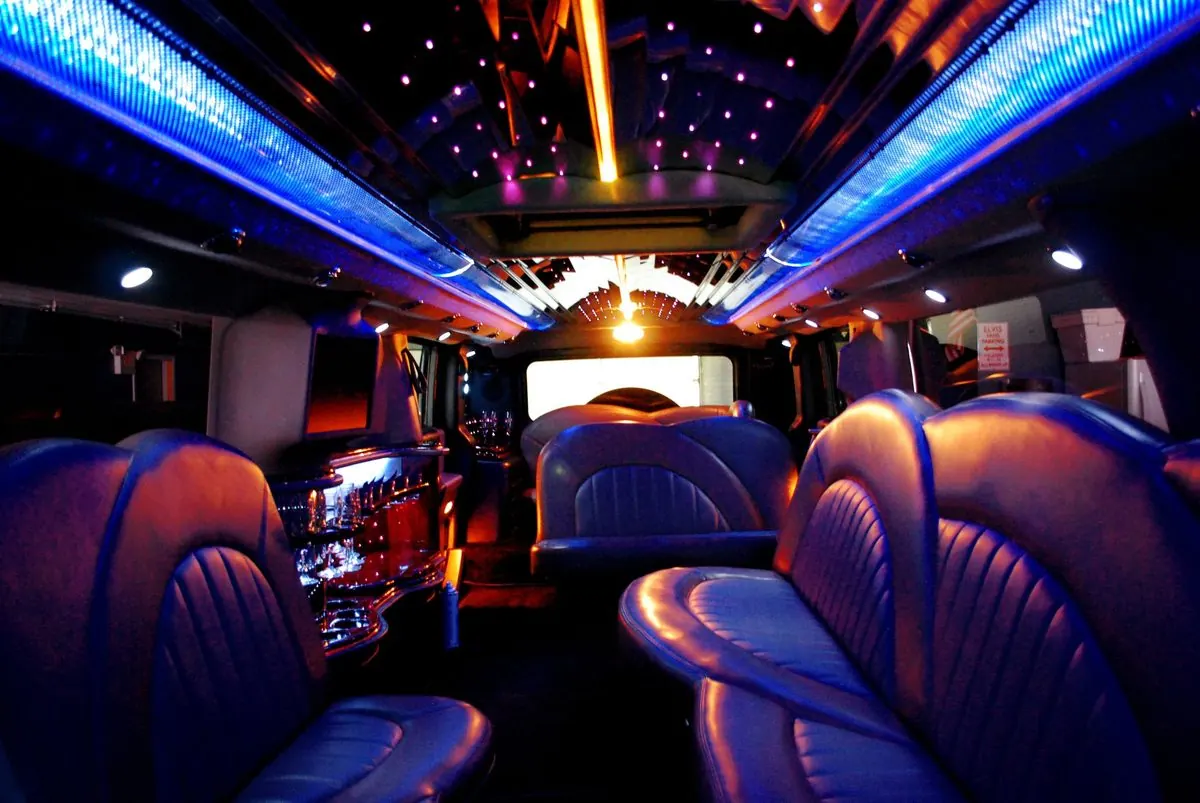 Party bus interior with purple and blue LED lighting
